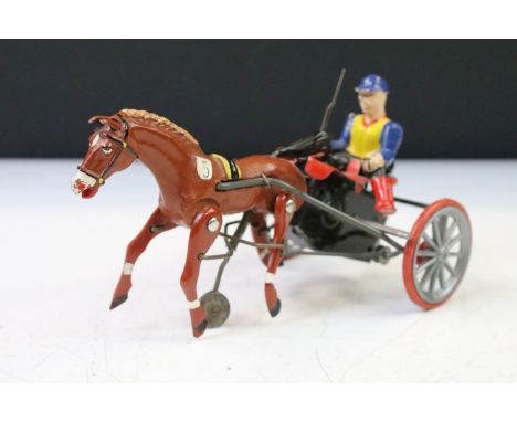 Mid 20th Century DGM West German Arabian No. 5 tin plate clockwork model of horse and cart with whip and moving wheels, all i