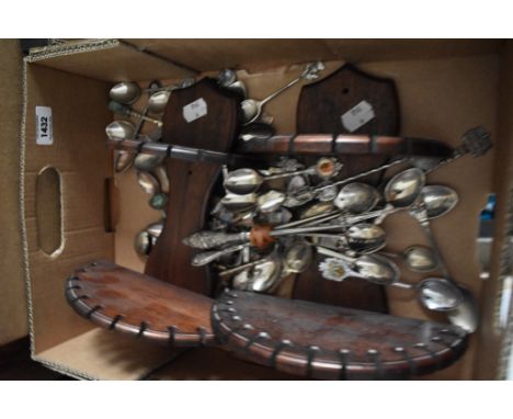 A collection of assorted teaspoons and two display shelves. Also included are three hallmarked silver button hooks.