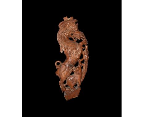 20th century AD. A South Indian teak wood carved roof bracket from a temple or courtyard house in the form of a rearing Yali 