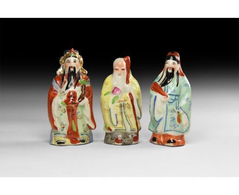 20th century AD. A group of three hollow-formed glazed ceramic figures in colourful courtly robes.   292 grams total, 90-96mm