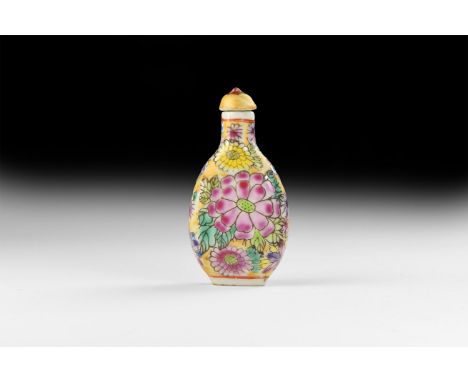20th century AD. A glazed ceramic snuff bottle with domed lid, polychrome chrysanthemum design.   47 grams, 78mm (3"). Proper