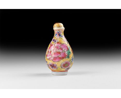 20th century AD. A glazed ceramic snuff bottle, piriform with domed lid, chrysanthemum design with calligraphic stamp to the 