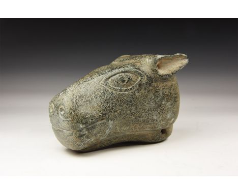 An undated archaistic carved schist beast-head finial with incised lentoid eyes, scrolled nostrils, piriform ears; socket to 