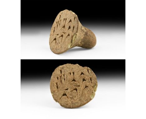 An undated archaistic conical ceramic seal matrix pierced for suspension, pseudo cuneiform text to the underside with three s