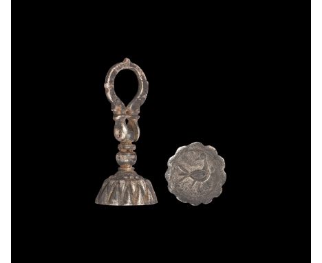 13th-14th century AD. A silver seal matrix comprising a flat-section loop handle with scale detailing, fish-head finials; art