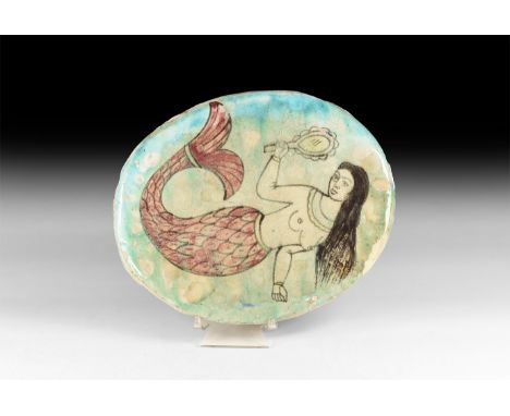 19th-20th century AD. A glazed ceramic discoid plaque with mermaid holding a looking-glass; hanger to reverse.   1.1 kg, 24.5