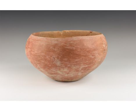 1st century BC-1st century AD. A ceramic bowl with conical underside, flat base, inturned rim.   685 grams, 18cm (7"). Proper