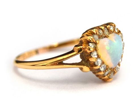 A late Victorian 18ct gold, opal and diamond heart-shape ring, the central heart-shape opal cabochon surrounded by old cut di