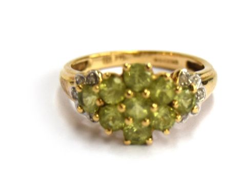 A 9ct gold peridot and diamond cluster ring, gross weight 2.5g, size K.5