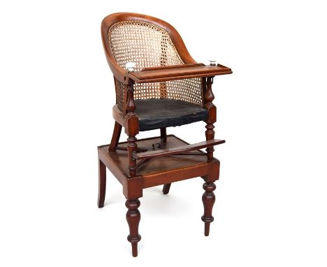 A Victorian child's high chair, mahogany with caned back. The chair has a footrest, and the original restraining bar has been