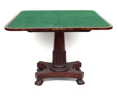 A Georgian card table, the fold-over top with swivel action enclosing a hidden compartment, the pedestal base with four ball 