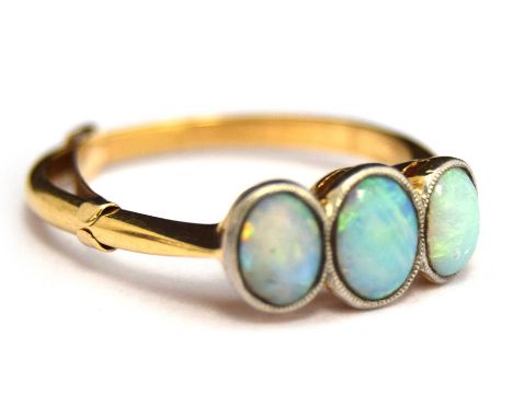 An 18ct Opal Ring, Size N (with 9ct adjuster) and O without, 2.87g