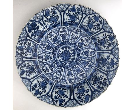 Chinese blue and white charger, Kangxi (1662-1722), with lobed rim, decorated with radiating lotus-shaped panels containing s