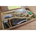 Wooden case containing flints, powder flask, percussion caps, .44 and .36 double cavity brass bullet