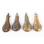 Four embossed brass powder flasks with similar scroll decoration, two by G & J W Hawksley