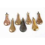 Seven various copper and brass bag shaped powder flasks by Sykes, Dixon and others All in reasonable