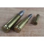 Inert 30mm brass practice round with one other, and a H. Utendoerffer No.10 Nurnberg brass case