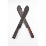 Two war issue machetes: 14½ ins bolo blade by Samuel Kitchin, dated 1917 with broad arrow, with a