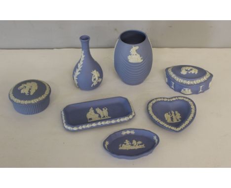 A group of seven Wedgwood blue jasper ware items, vases, trinket boxes, trays