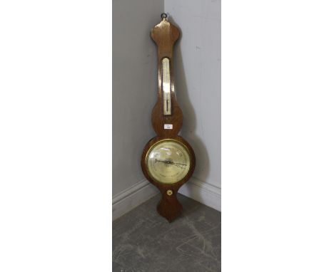 A 19th century mahogany wheel or banjo barometer, by Wilson, Penrith. With thermometer scale and silvered dial over the ivory