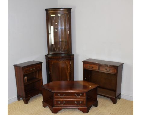 A group of modern reproduction mahogany furniture, comprising two small open bookcases, a glazed double corner cupboard, and 