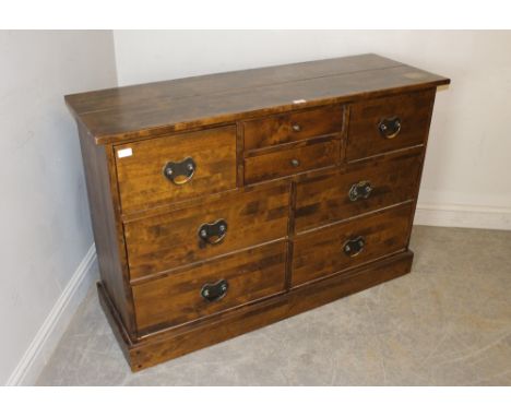 A Laura Ashley 'Home' dark wood effect chest of drawers 85cm x 126cm x 43cm some marks and scratches, small patch of fading t