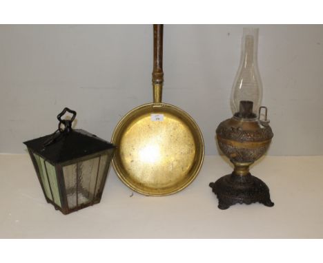 A Victorian embossed copper and cast-iron 'Miller' oil lamp, a glazed iron lantern and a brass warming pan, codition commensu