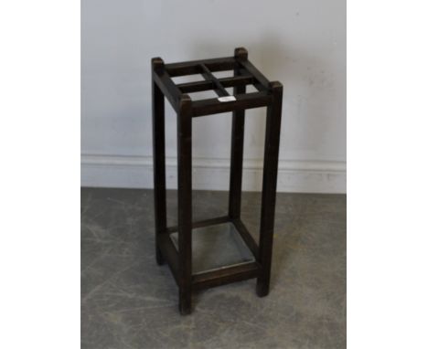 An early 20th century oak four division stick/umbrella stand, of square section form with removable drip-pan 65.5cm high, mar