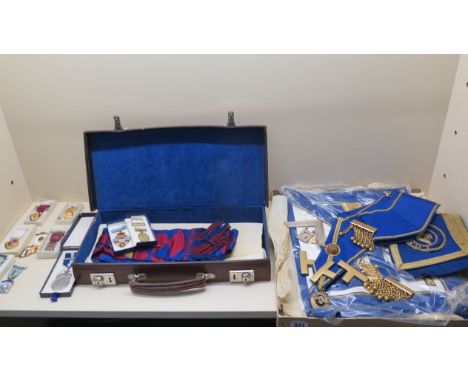 Masonic regalia with a silver sash pendant and two silver and enamel jewels 