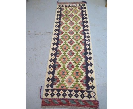 A hand knotted woollen Chobi Kilim Runner, 203cm x 66cm, in good condition 