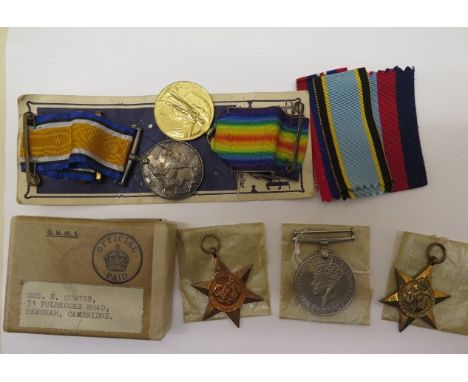 A family group of medals: Condolence WWII group of medals,to Sergeant R W Curtis The Air Crew Europe Star, War Medal and 1939