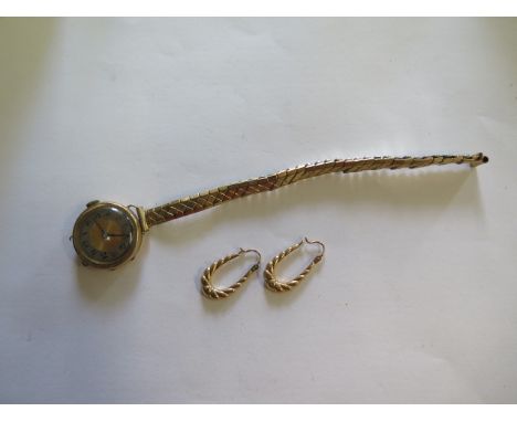 A 9ct yellow gold manual wind ladies wristwatch on a plated strap running but lug broken, total weight approx 23.5 grams and 