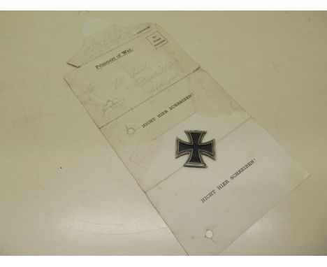 A German Prisoner of War letter, dated 21 November 1917, and a 1939 German Cross, missing its loopTranslationTranslation of l