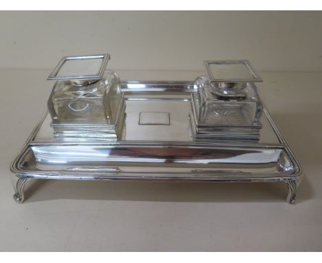 A silver two bottle desk inkwell, London 1896/97, base approx 13.3 troy oz, some general wear but glass good 