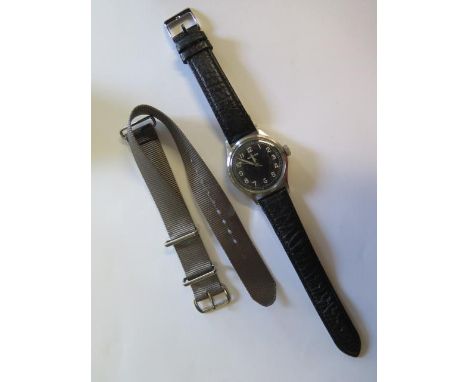 A Record Military ex Kenyan Army 1960s manual wind wristwatch, 35mm case, in good condition, running hands adjust with a blac