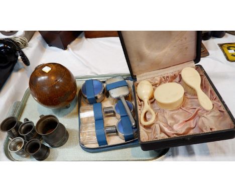 A coffee caddy; pewter measures; knife rests, sugar nips; an overnight case;   a selection of tins etc 