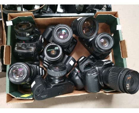 8 vintage Minolta cameras with various lenses 