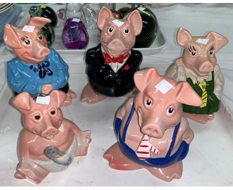A graduating set of 5 Wade Nat West pig money boxes, father, mother, son, daughter and baby 
