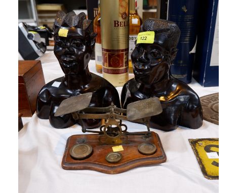 A set of 19th century postage scales and weights; a pair of African carved heads 
