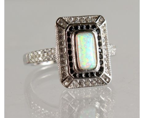 A SILVER AND OPAL DECO DESIGN RING.