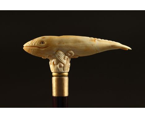 A BONE HANDLE WALKING STICK, carved as a whale. 36ins long.