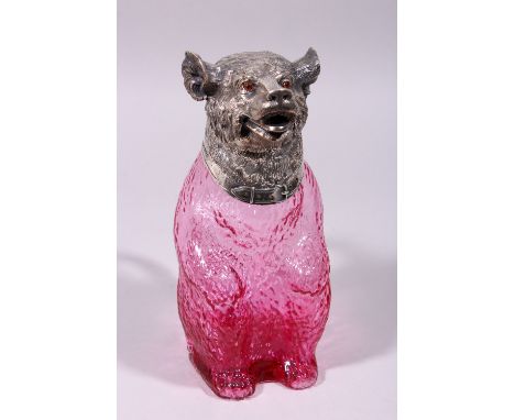 A RUBY GLASS AND PLATE BEAR DECANTER.