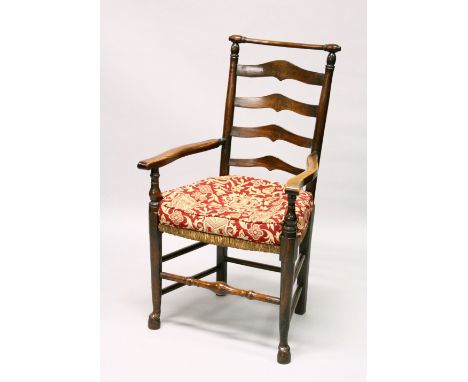 A GOOD 18TH CENTURY OAK LADDER BACK ARMCHAIR, with rushwork seat.