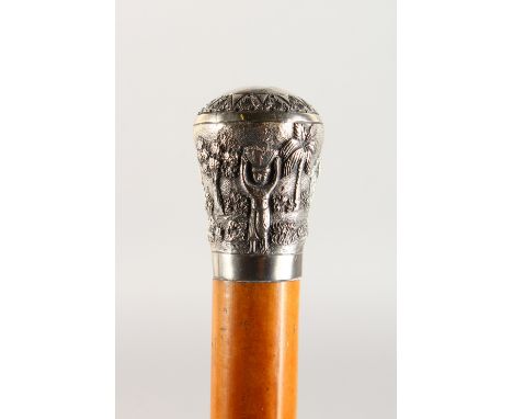 A MALACCA WALKING STICK, with embossed white metal top. 36ins long.