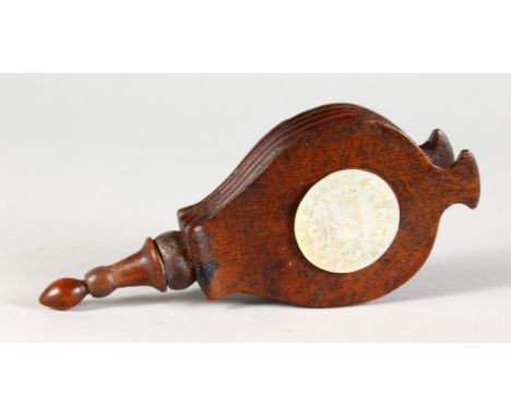 A SUPERB SMALL PIECE OF TREEN, A PAIR OF WOODEN BELLOWS with mother-of-pearl circular panel. 5.25ins long.