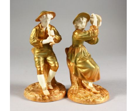 A PAIR OF ROYAL WORCESTER PORCELAIN FIGURES, modelled as the boy piper Stephon and companion Phyllis, she playing a tambourin