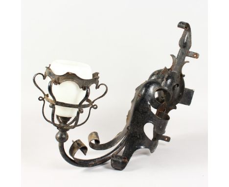 A GOTHIC STYLE WROUGHT IRON WALL LIGHT, with opaque glass shade. 18ins high.
