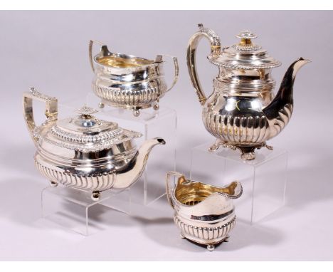 A GEORGE III AND GEORGE IV SEMI FLUTED FOUR PIECE TEA SET, with acanthus mounts, gadrooned edge and shell feet, comprising te