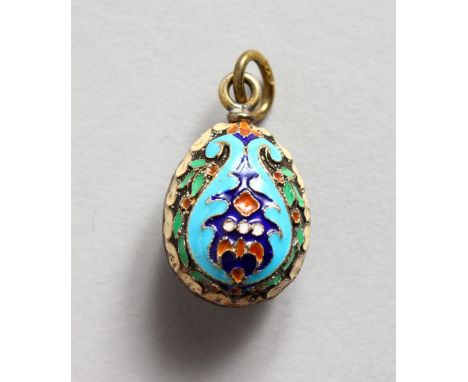 A SMALL RUSSIAN SILVER AND ENAMEL EGG SHAPED PENDANT. 0.75ins long.