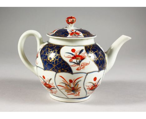 AN 18TH CENTURY WORCESTER TEAPOT AND COVER, painted with panels in Imari style.